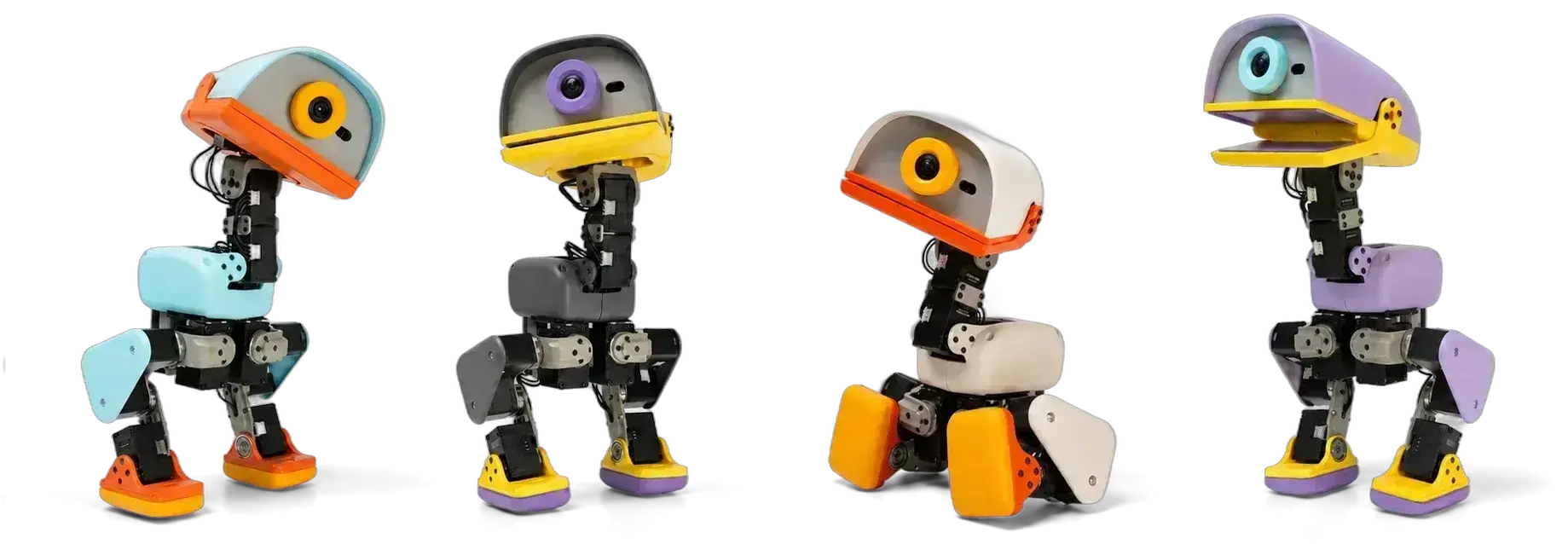 How $microduck Turned a 9 Robot Into an NVIDIA Narrative Four MicroDuck robots photographed in profile against white in different colourways, showing the camera eye, hinged beak and jointed metal legs.
