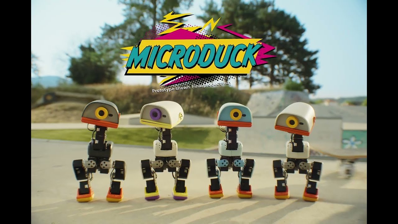How $microduck Turned a 9 Robot Into an NVIDIA Narrative Four MicroDuck robots on roller skates at a skate park beneath a comic-style MICRODUCK logo, with on-screen text noting that a prototype is shown.